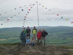 Flying prayer flags at the top of Slemis. Canon Stuart Lloyd, rector of St Patrick's, Ballymena, is on the right.